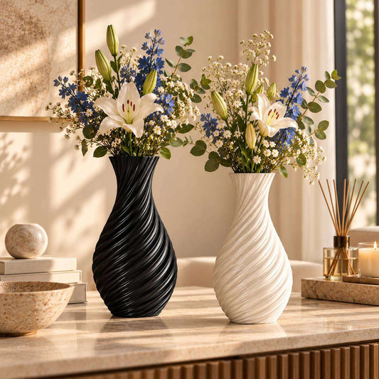 Black and white Spiral Wave Vases styled with flowers on a living room console
